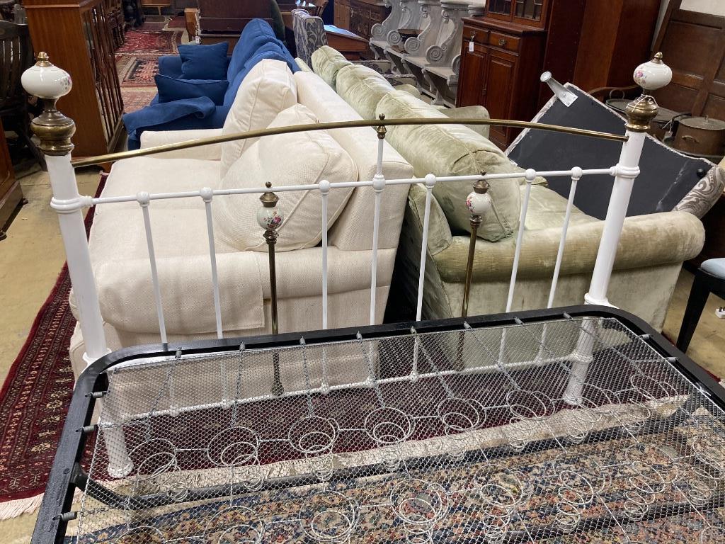 A Victorian style brass and painted iron porcelain mounted bed frame, width 150cm, length 210cm